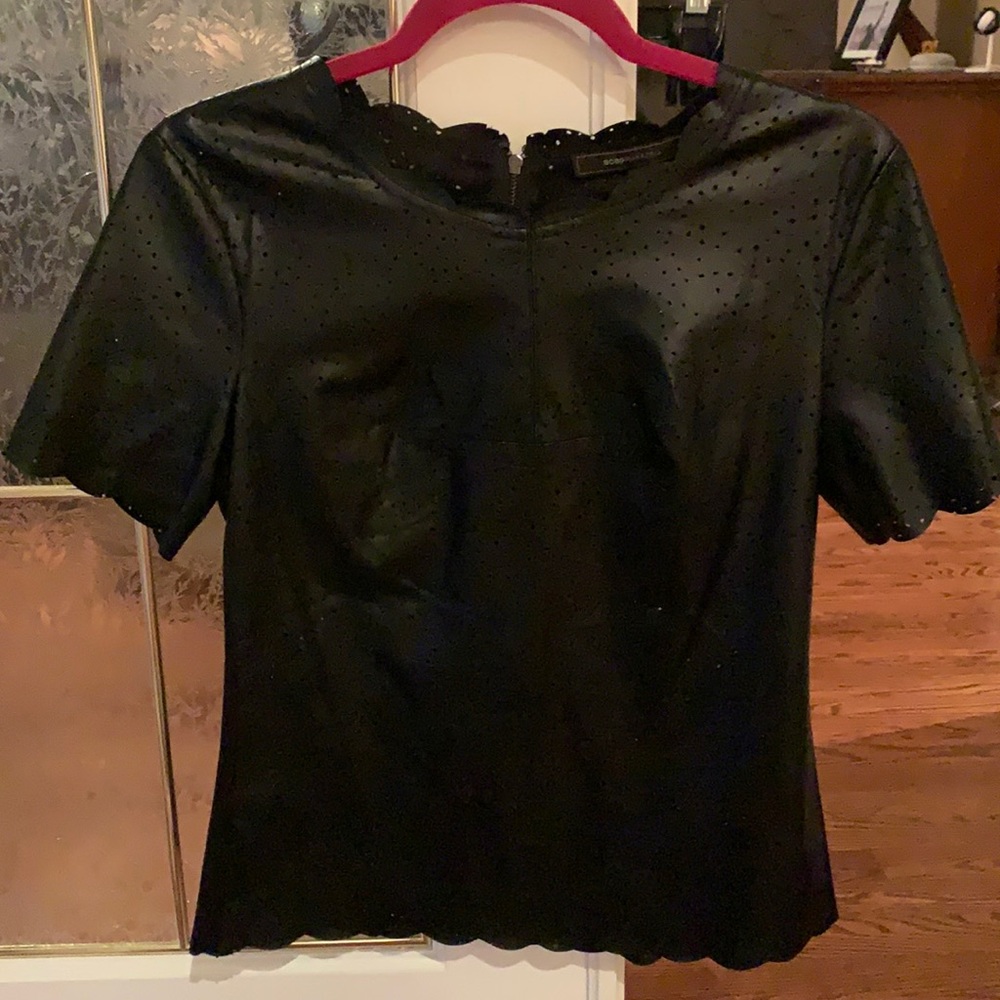 Trendy BCBG stunning black faux leather top, scalloped arms, collar  and bottom